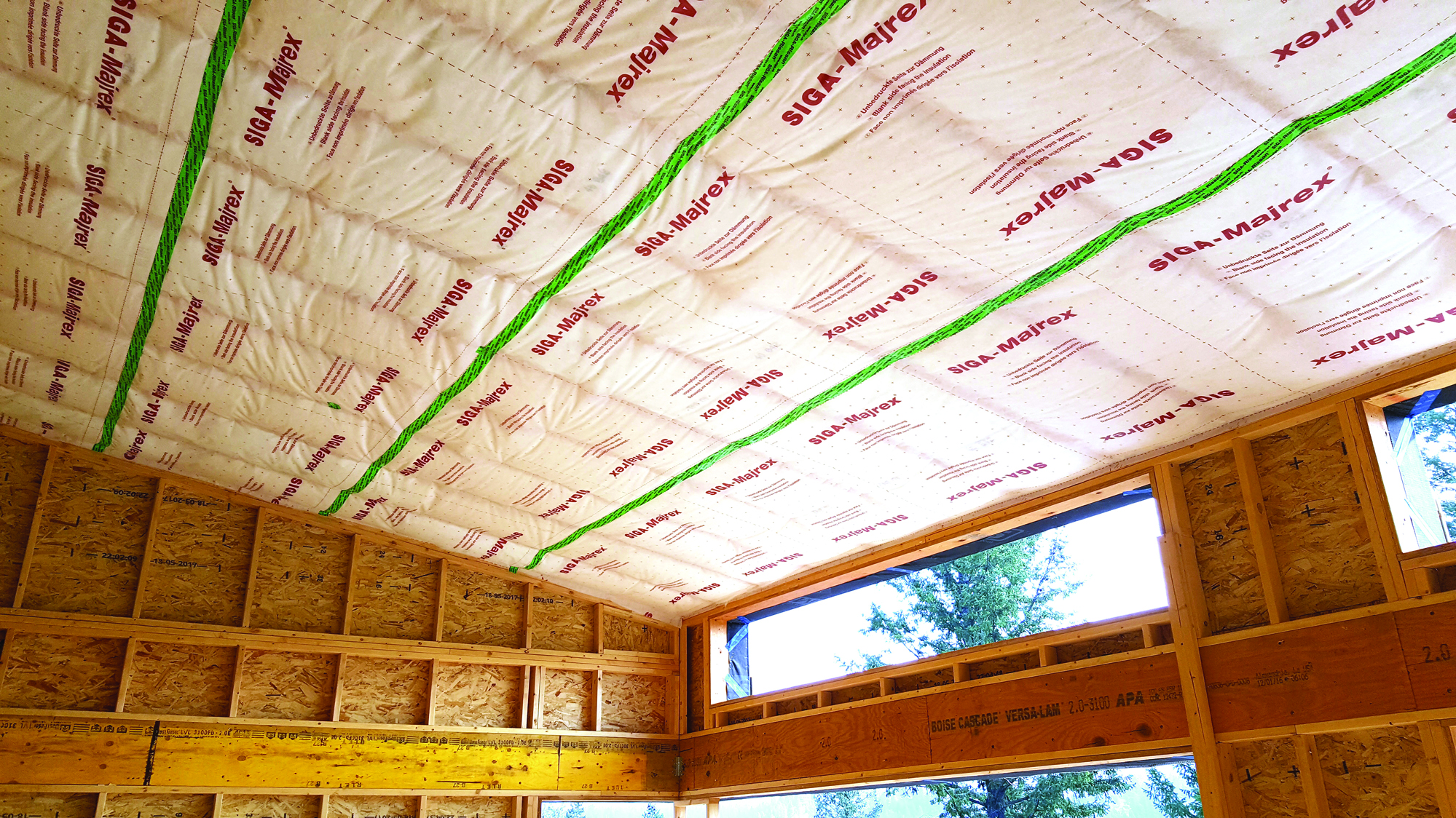 Ceiling vapor barrier between joists of living space