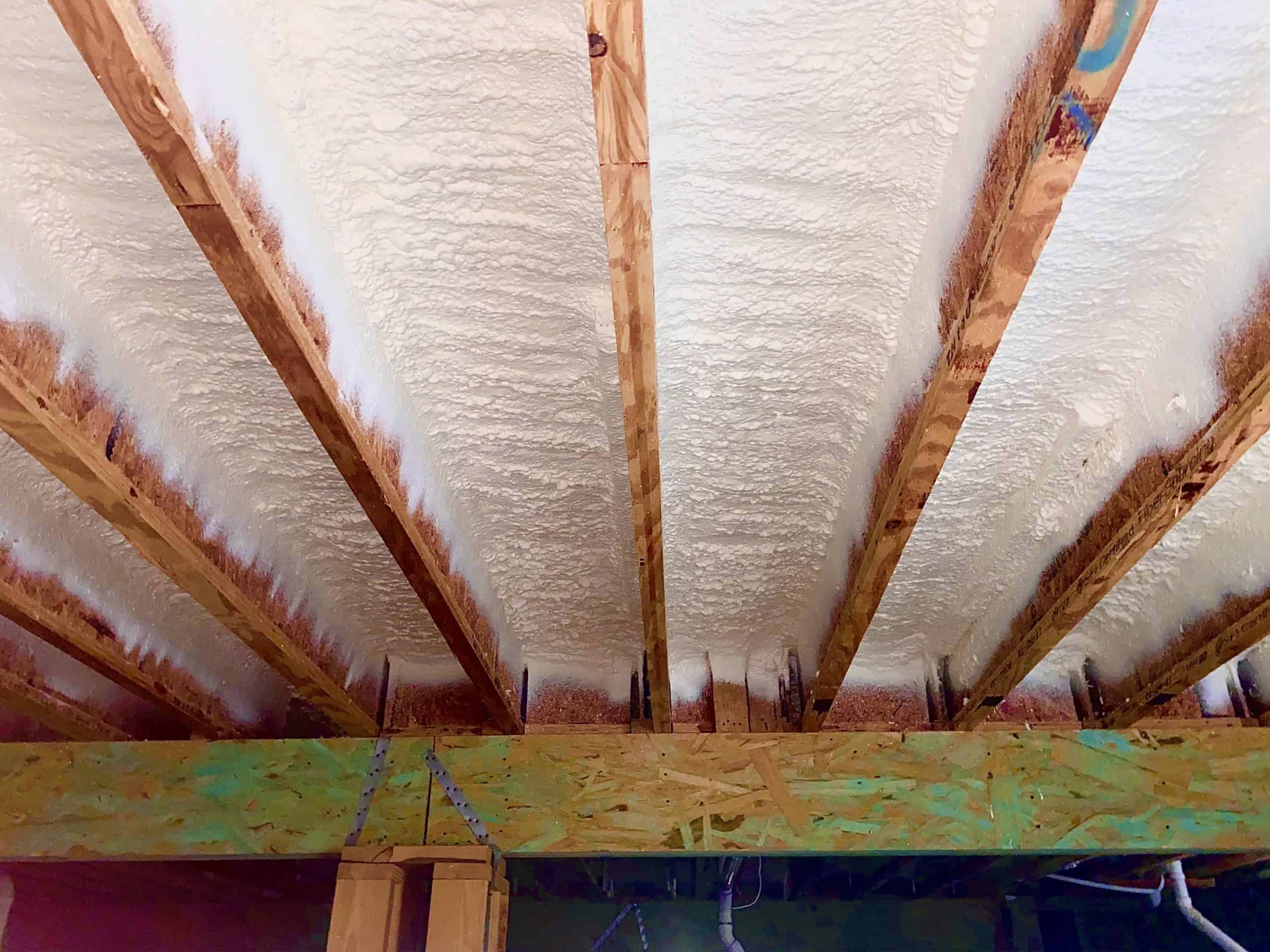 Installed spray foam board insulation under sagging floors to prevent wood rot